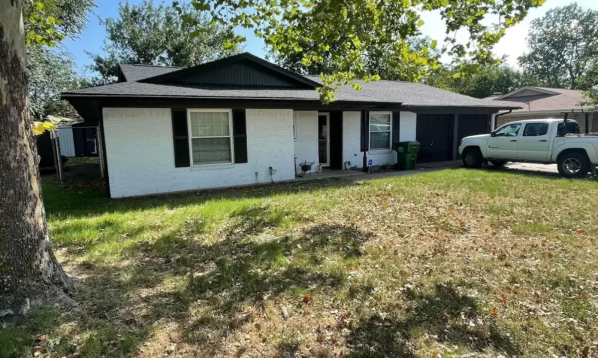 Professional roofing crew working on a residential roof in Beltsville